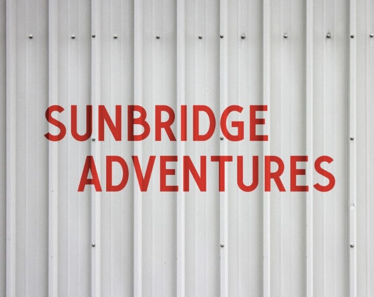 The Sunbridge Adventures logo painted on a metal wall