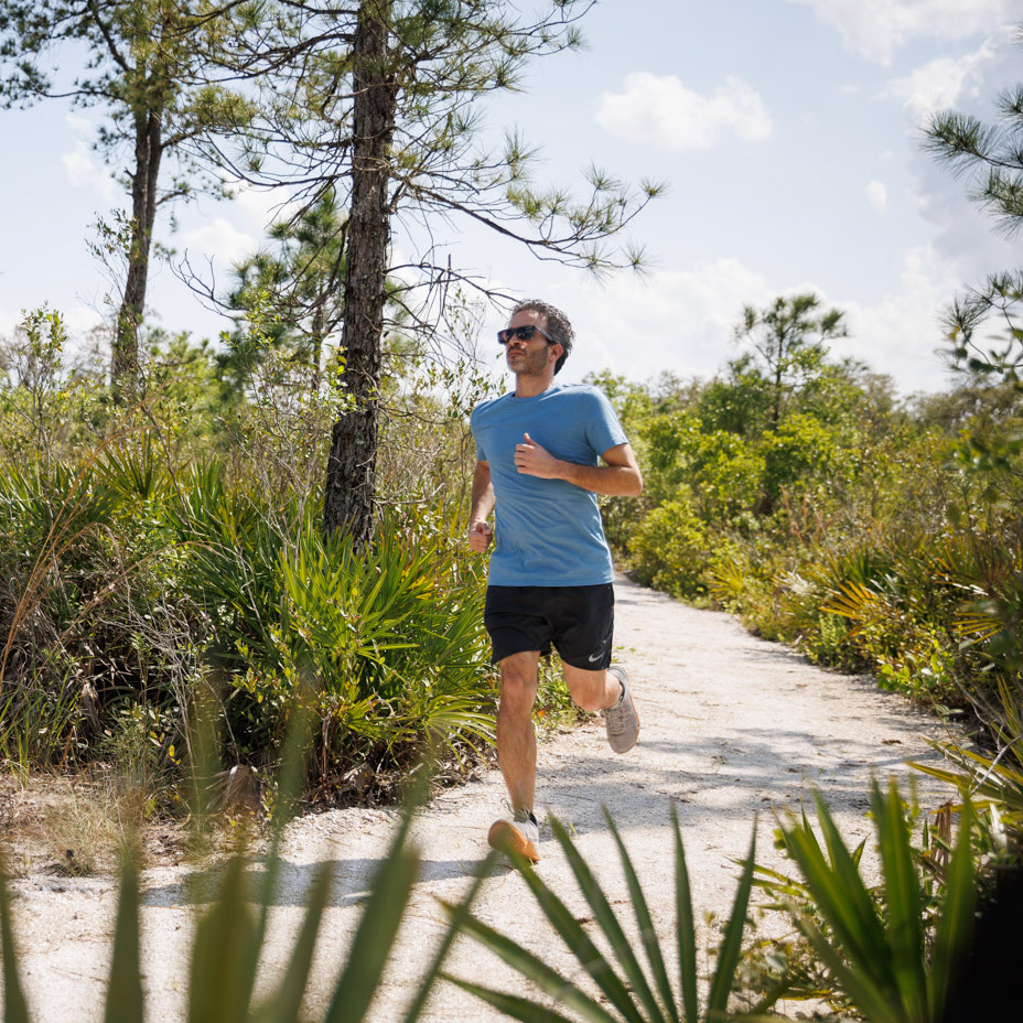 man running through basecamp trails