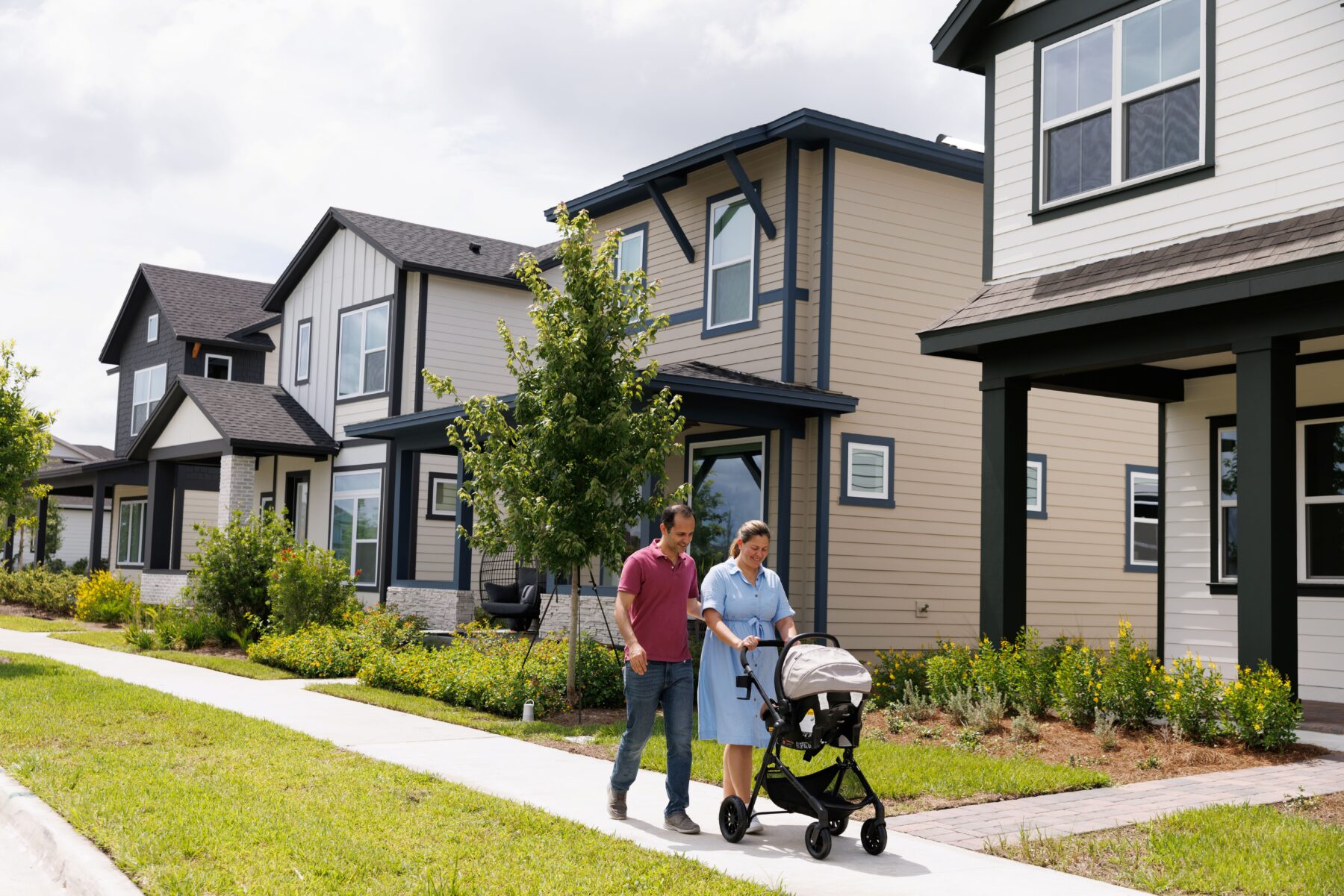 couple walking outside with a baby